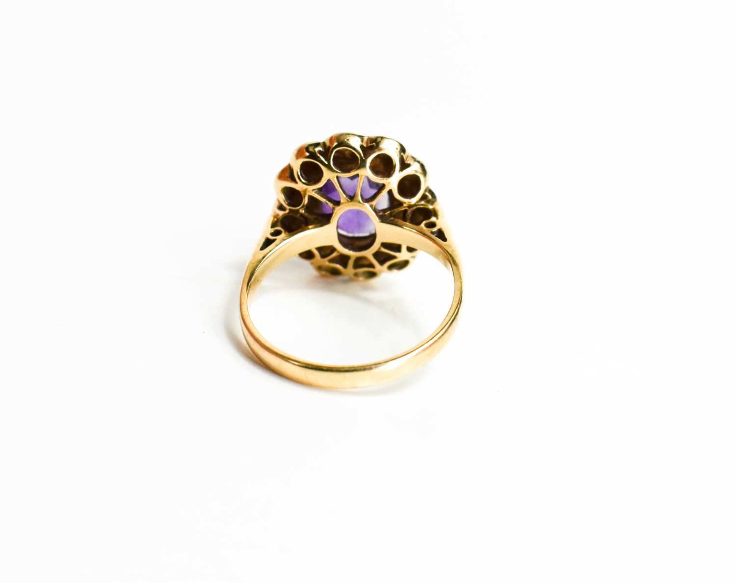 A 9ct gold, amethyst and seed pearl ring, the oval cut amethyst 10mm by 7mm, bordered by seed - Image 4 of 6