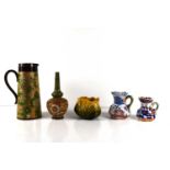 A Doulton Lambeth Slater jug and bud vase A/F, a William Ault vase designed by Christopher Dresser