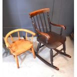 A Victorian mahogany children's rocking chair together with an oak spindle back child's armchair.