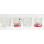 Four Rosenthal Studio-Line twisted glass candle vases, two with red bottoms., 8cm tall.