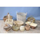 A group of wicket baskets of different sizes together with a quantity of garden trugs.