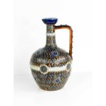 A 19th century Doulton Lambeth jug decorated with an incised and applied feathered design, signed HW