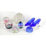 A group of glass paperweights and ornaments to include Caithness paperweight, Tutbury glass shoes