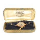 A vintage Bravington's Renown 9ct gold cased ladies wristwatch, leather strap, in original