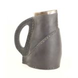 A Doulton Lambeth late 19th century silicon ware jug, in a stitched leather form with a silver