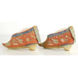 A pair of Chinese bound feet shoes or 'lotus shoes', circa 1900, hand embroidered on red silk