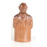 A Doulton Lambeth stoneware reform cordial flask, modelled as David Lloyd George, 19cm.
