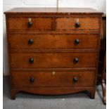 A 19th century oak chest of drawers with two over three long graduated drawers, raised on bracket