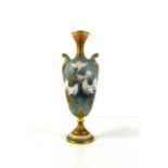 Charles Baldwyn for Royal Worcester, a small baluster shaped pedestal vase with scroll handles,