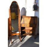 An Art Nouveau period oak desk, the sloped front with metal straps, opens to reveals a fitted