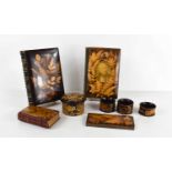 A collection of Mauchline Fernware, to include three napkin rings, a cotton reel box, Wordsworth and