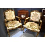 A pair of French style bedroom chairs with floral upholstery together with an Edwardian mahogany
