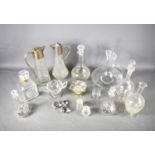A quantity of vintage glassware to include a number of decanters with stoppers, and two jugs