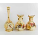 A pair of Royal Worcester blush ivory ground vases, circa 1890, painted with summer flowers, and