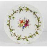 A Royal Worcester plate, by Ernest Phillips (working 1890-1932): painted with central reserve of