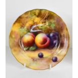 A Royal Worcester plate by Horace Price, painted with peaches and grapes to a mossy ground, puce