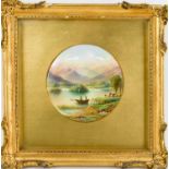 A 19th century circular Paragon plaque, painted with a view of Rydal water, 11cm diameter, in the