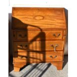 An Edwardian mahogany and satinwood cross banded bureau, the fall enclosing a fitted interior