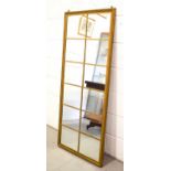 A large gilt wood hall mirror in the style of a window, 144cm by 62cm.This lot is not part of the