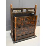 A 19th century Chinese black lacquered stacking chest, the decorative frame housing five sections