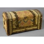 A 19th century dome top casket, clad in 18th century French floral tapestry, ring form handles to