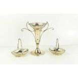 A silver stem vase with matching bon bon baskets, the vase having shaped handles with curled fronds,