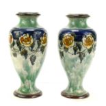 Eliza Simmance for Royal Doulton: A pair of baluster form vases decorated with scrolling foliage