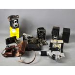 A collection of vintage cameras to include Isbar, Gauthier, Halina, Kodak Brownie, Carena Zoomex