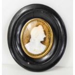 A 19th century profile portrait, of oval form with ebonised moulded frame.