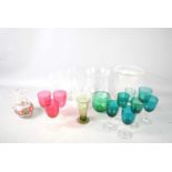 A group of green and cranberry glasses, along with vases, etc.