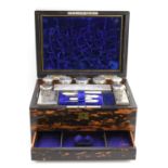A coromandel vanity box, complete with fitted interior, glass bottles and boxes, all with silver