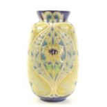 A Royal Doulton stoneware vase, by Francis C. Pope, the body decorated with flowers and leaves in