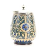 Edith D Lupton for Doulton Lambeth: A biscuit barrel with silver plated lid, the body decorated with