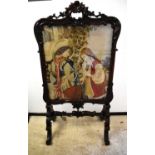 A large Victorian mahogany firescreen, the frame flamboyantly carved in the Rococo Revival style,