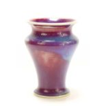 A Ruskin flambe glazed vase in red, blue and purple mottled hues, scissor mark to the base, dated