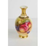 A Royal Worcester vase by Mosley, painted with fruit shape number 286, signed, 11cm high.