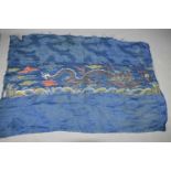 A late 18th / early 19th century woven cloth with silk embroidered four clawed dragon and a cloud