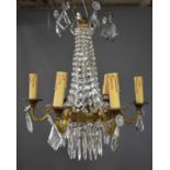 A French antique brass and cut glass chandelier, with six branches, waterfall drops, and upper