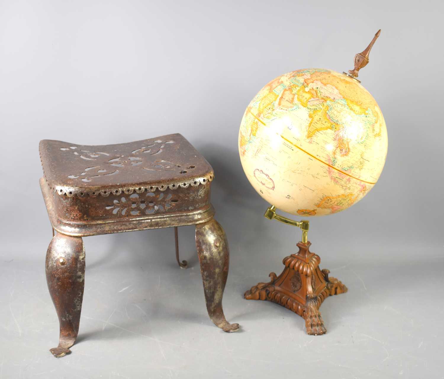 A Victorian steel footman together with a vintage Replogle globe on stand, 60cm high.