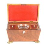A Regency mahogany sarcophagus tea caddy with boxwood stringing, parquetry starburst decoration to