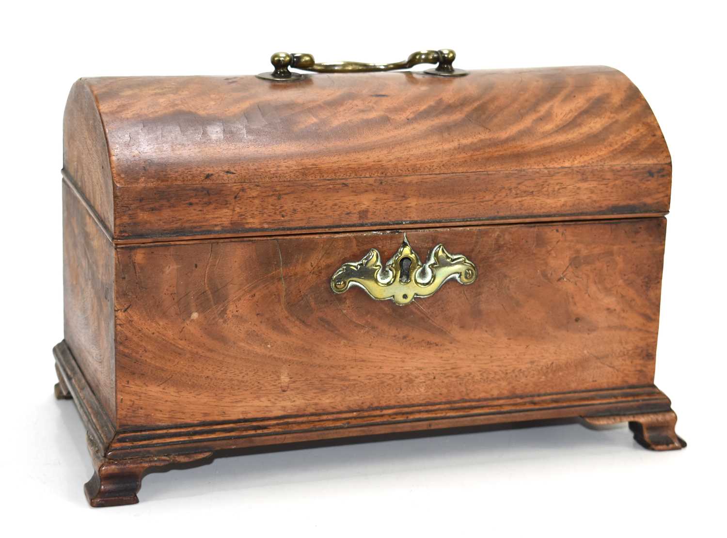 A 19th century mahogany small chest of sarcophagus form, the domed lid with swan neck handle, raised