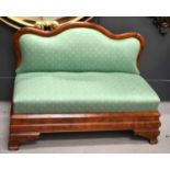 A small Chinese style banquette sofa with curved back, box base and raised on shaped bracket feet,