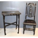 An ebonised small hall table, the tope carved with peonies, 60 by 36 by 76cm high, together with a