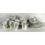 A Heathcote China Art Deco part tea set together with a Shelley cup and saucer.