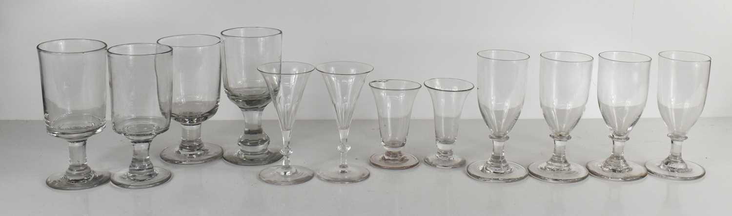A selection of antique glasses including Georgian and Victorian examples, of various size and form.