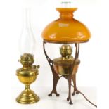 An Art Nouveau style paraffin lamp later converted to electric, together with a brass oil lamp.