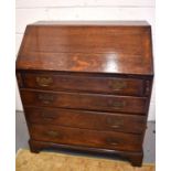 An 18th century oak bureau, the fall front enclosing a fitted interior, above four long graduated