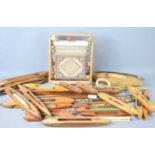 A collection of weaving related items, including a pair of Chinese weaving sticks, shuttles and a