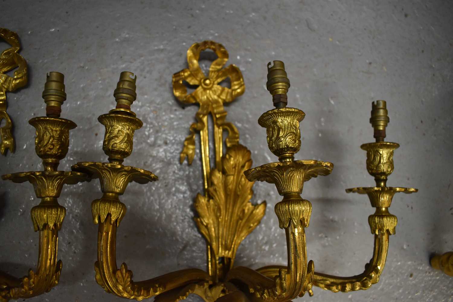 A pair of 19th century French gilt bronze wall sconces, with three branches raising 'candle' - Image 2 of 2