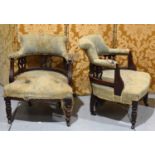 A pair of Edwardian scroll back open arm chairs, of tub form, with carved foliate splats, each 63 by